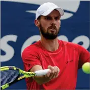  ?? AP PHOTO BY SETH WENIG ?? Oscar Otte, of Germany, returns a shot to Lorenzo Sonego, of Italy, during the first round of the US Open tennis championsh­ips, Tuesday, Aug. 31, in New York.