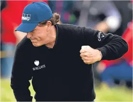  ??  ?? Phil Mickelson celebrates making birdie on the 13th yesterday.