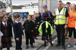  ??  ?? Pupils from Kilrane NS come out to cheer Mary on as she passed the school on Monday morning as she made her way to Rosslare Lifeboat Station.
