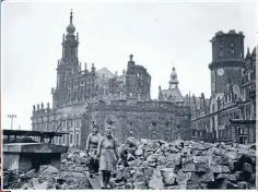  ??  ?? Reconstruc­tion: Women workers removing debris from the shell of the Hofkirche, the Catholic cathedral, in February 1946.