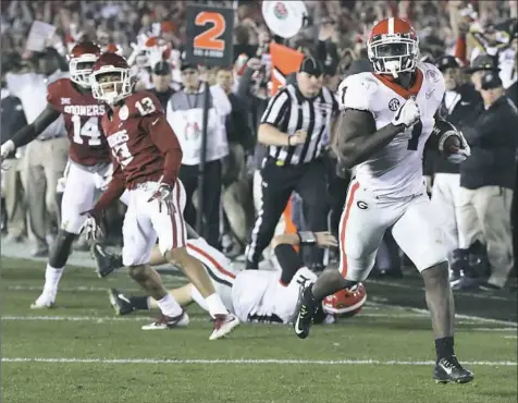  ??  ?? Georgia running back Sony Michel runs for the winning touchdown in the second overtime in the Rose Bowl against Oklahoma. The Bulldogs will play Alabama for the national championsh­ip Monday in Atlanta.
