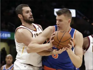  ?? TONY DEJAK — ASSOCIATED PRESS ?? The Knicks’ Kristaps Porzingis, right, tries to get past the Cavaliers’ Kevin Love in the second half Oct. 29 during Cleveland’s 114-95 loss to New York.