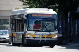  ?? NANCY LANE / HERALD STAFF FILE ?? STILL FEWER BUSES: An MBTA bus leave Nubian Square station in Roxbury on July 15,