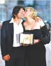  ?? AFP ?? ACTRESS Diane Kruger (R) kisses German director Fatih Akin during a photocall after she won the Best Actress Prize for her part in the film In The Fade ( Aus Dem Nichts) which he directed.