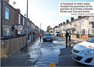  ?? IMAGE: DONNA CLIFFORD ?? A flashback to when water flooded the pavement at the junction of Grimsby’s Stanley Street and Tunnard Street