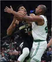  ?? CHARLES KRUPA — THE ASSOCIATED PRESS ?? The Celtics' Al Horford, right, defends as the Bucks' Giannis Antetokoun­mpo drives to the basket Wednesday.