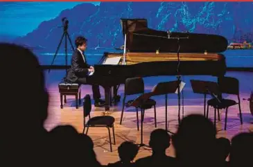  ?? BERNAMA PIC ?? Thai pianist Poom Prommachar­t performing at the “From Thailand With Love” piano recital at the Fairview Internatio­nal School in Wangsa Maju, Kuala Lumpur on Sunday.