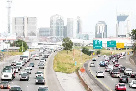  ??  ?? In this file photo, heavy traffic moves away from and toward the downtown area of Nashville, Tenn. From the middle of the Obama administra­tion to the midpoint of the Trump administra­tion, household income grow the most in growing tech and entertainm­ent centers like in Austin, Nashville, Pittsburgh and large chunks of the West Coast, while it declined the most in former manufactur­ing and mining hubs like High Point, N.C., and Scranton, Pa., according
to new figures released by the US Census Bureau. (AP)