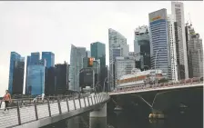  ?? EDGAR SU/REUTERS FILES ?? Singapore was ranked the most competitiv­e economy for the second year in a row. Canada moved up to eighth spot.
