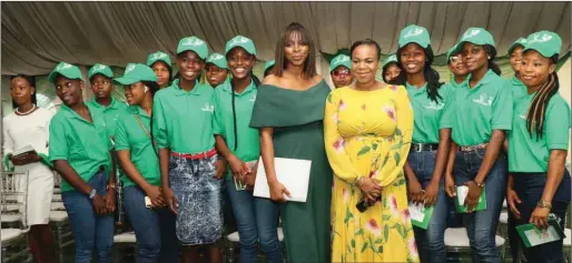  ??  ?? Anita Otubu and Damilola Ogunbiyi surrounded by 20 all female STEM participan­ts who received certificat­es of completion for renewable energy training