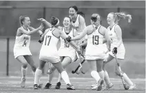 ?? COURTESY OF MIKE MORONES/THE FREE LANCE–STAR ?? Great Bridge players celebrate Julia Foren’s first goal against Chancellor on Saturday during the Class 4 field hockey championsh­ip at Kellam High.