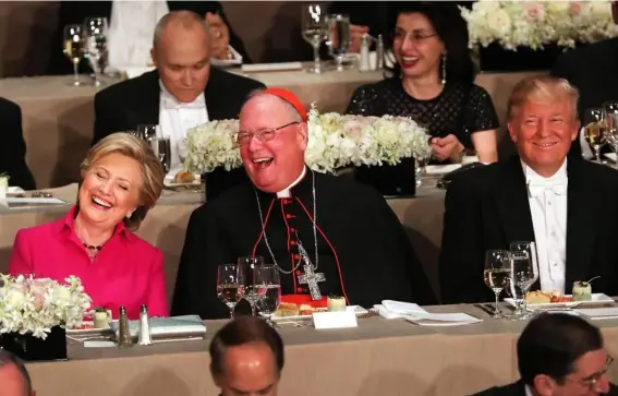  ?? (Getty) ?? Hillary Clinton, Cardinal Timothy Dolan and Donald Trump at the annual Alfred E Smith Memorial Foundation Dinner