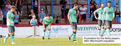  ??  ?? Frustratio­n for the Notts players after Weymouth’s equaliser.