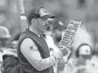  ?? AARON DOSTER/AP ?? Browns coach Kevin Stefanski looks at his play sheet during Sunday's game against the Bengals.