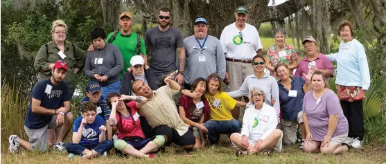  ??  ?? River trips, campfires and archery are part of the fun at Trailways Camp in Alva. And nothing makes memories like a group photo (below).