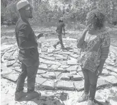  ??  ?? Oba Adejuyigbe Adefunmi and Kamora Le’Ella Herrington of Kamora’s Cultural Center discuss constructi­on of a labyrinth at 75 Sterling St. in Hartford.