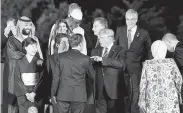  ?? Susan Walsh / Associated Press ?? President Donald Trump talks with his French counterpar­t, Emmanuel Macron, at Osaka Castle.