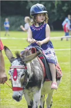  ?? FM4813568 ?? Rose Moir, five, takes a leisurely donkey ride