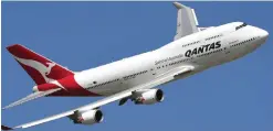  ??  ?? Photo shows a Qantas Boeing 747 in the skies above Melbourne. Australian carrier Qantas yesterday, got shot of its ‘junk’ status when Standard & Poor’s lifted its rating from ‘BB+’ to the prized investment grade ‘BBB-’ as the airline bounces back from...