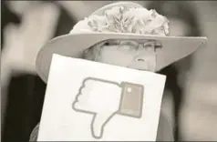  ?? AFP ?? A protester during a demonstrat­ion outside Facebook’s headquarte­rs in the wake of Cambridge Analytica's unauthoris­ed access to around 87 million Facebook users' data