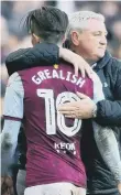  ??  ?? Steve Bruce hugs Jack Grealish