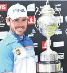  ??  ?? PERFECT DAY Oosthuizen lifts trophy