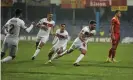  ?? Anadolu Agency/Getty Images ?? Orkun Kokcu is chased by his teammates after scoring Turkey’s crucial winner. Photograph: