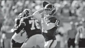  ?? AP/JASON BEHNKEN ?? Washington Redskins quarterbac­k Alex Smith (11) throws a pass Sunday against the Tampa Bay Buccaneers during the first half of an NFL football game in Tampa, Fla.