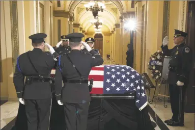  ?? Pool / Getty Images ?? The flagdraped casket of U.S. Rep. Elijah Cummings, DMaryland, is seen as the late congressma­n lies in state at the Statuary Hall of the U.S. Capitol Thursday.