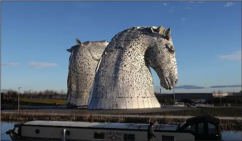  ??  ?? Low winter sunshine at the Kelpies on the Forth and Clyde canal at Falkirk as the freezing cold weather continues Picture: Andrew Milligan