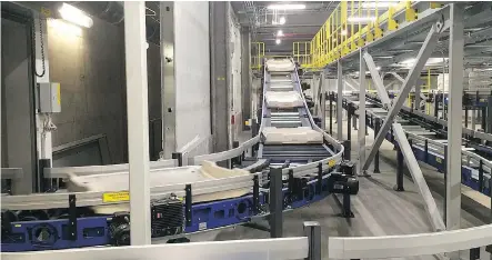  ??  ?? Calgary is the first Canadian city to adopt an automated baggage system by Danish company Beumer Group, which is designed to cut down on lost bags.