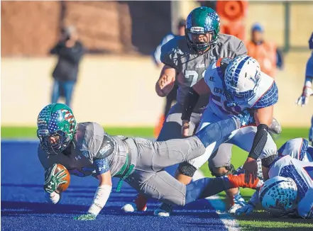  ?? ROBERTO E. ROSALES/JOURNAL ?? Rio Rancho’s Josh Foley dives in for a score against Las Cruces on Saturday as the host Rams powered their way to their second state championsh­ip in the past three seasons. The Rams broke open a close game at the half to win 39-17 in Rio Rancho.