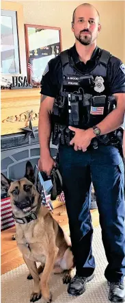  ?? ?? Officer Blaze Brooks with K-9 Arko