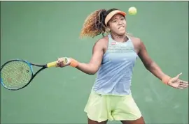  ?? Harry How Getty Images ?? NAOMI OSAKA reached the quarterfin­als of the BNP Paribas Open with a 6-1, 5-7, 6-1 victory over Maria Sakkari of Greece. She’ll face Karolina Pliskova.