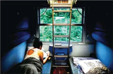  ?? AFP ?? A traveller reads in a sleeper car of the Paris-Nice night train which will run daily between Paris and Nice in both directions.