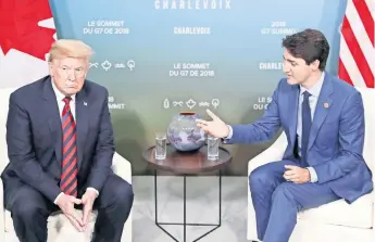  ??  ?? Donald Trump, presidente de EU, y Justin Trudeau, primer ministro canadiense durante una reunión que sostuviero­n el pasado 8 de junio con motivo del encuentro del G7 en Quebec, Canadá.