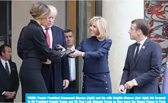  ??  ?? PARIS: French President Emmanuel Macron (right) and his wife Brigitte Macron (2nd right) bid farewell to US President Donald Trump and US First Lady Melania Trump as they leave the Elysee Palace in Paris yesterday. —AFP