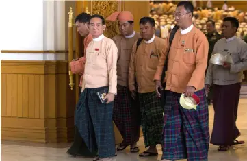  ??  ?? Win Myint, who recently resigned his post of speaker of the Lower House of Parliament, leaves the parliament, in Naypyitaw, Myanmar in this file photo. — Reuters photo