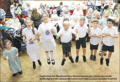  ?? PHOTOS: DAVID SOLOMON ?? Pupils from the Ilford and Clore Tikva primaries get a jump start at the Redbridge Jewish Community Centre and a centre member is served
