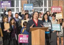  ?? RALPH BARRERA / AMERICAN-STATESMAN ?? Robin Schneider, of the Texas Campaign for the Environmen­t, joins other activists in support of bag ban ordinances last week outside the Texas Supreme Court building.