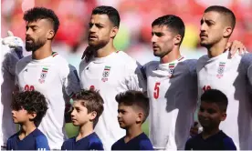  ?? Photograph: Richard Heathcote/Getty Images ?? Iran players during their national anthem before Friday’s World Cup game against Wales in Qatar.