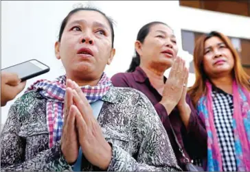  ?? PHA LINA ?? Duong Saktheary (left) and Ty Mary (centre), the mothers of jailed environmen­tal activists Dem Kundy and Hun Vanna, respective­ly, after delivering a petition to the Ministry of Environmen­t this month.