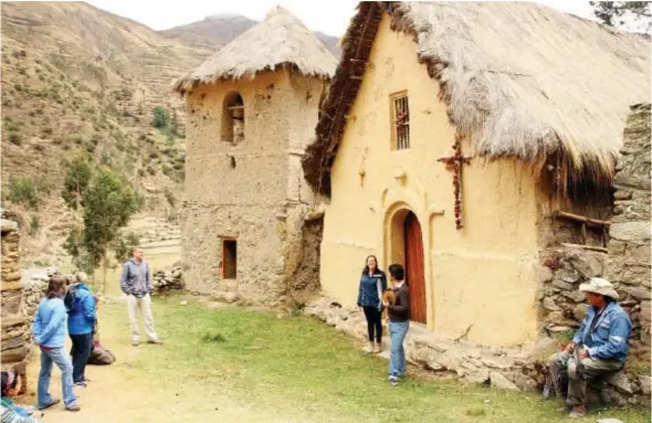  ?? PHOTOS: FRITZ FAERBER/ THE ASSOCIATED PRESS ?? Tourists gather outside a colonial-era church on the road between Ollantayta­mbo and Patacancha, Peru. Ollantayta­mbo is a gateway for tourists heading to Machu Picchu and offers homestays with locals. These homestays allow visitors to live like a local...