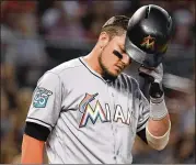  ?? GETTY IMAGES ?? Over the past 15 years, baseball has never seen more than two 100-loss teams in a season. Three this year are on pace for the century mark while Miguel Rojas (pictured) and the Marlins might fall just short.