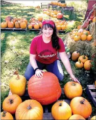  ?? Photo submitted ?? Melissa Bond’s daughter, Hannah Bond, poses with the pumpkin display the family created for family and close friends in early October.