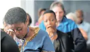  ??  ?? Family member Nomsa Mofokeng dabs her tears during the Life Esidimeni arbitratio­n hearings in Parktown, Johannesbu­rg.