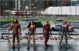  ?? WARNER BROS. ENTERTAINM­ENT INC. VIA AP ?? This image released by Warner Bros. Pictures shows Jason Momoa, from left, Gal Gadot, Ezra Miller and Ray Fisher in a scene from “Justice League.”