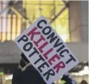  ?? CHRISTIAN MONTERROSA/AP ?? A protester holds a sign Wednesday in Minneapoli­s demanding a conviction of former suburban Minneapoli­s police officer Kim Potter.