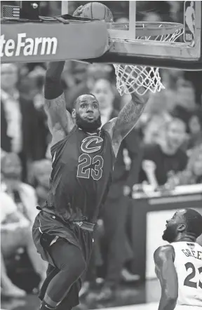  ??  ?? Former Cavaliers forward LeBron James goes to the basket against the Warriors during Game 4 of the NBA Finals on June 8. DAVID RICHARD/USA TODAY