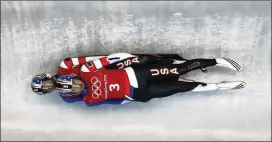  ?? CHARLIE RIEDEL / ASSOCIATED PRESS ?? Justin Krewson and Andrew Sherk, of the United States, take a practice run during the men’s doubles luge training at the Winter Olympics.